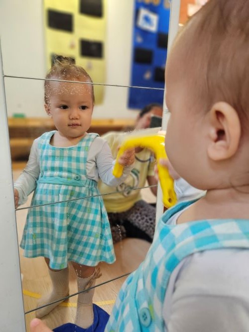 Toddler participating in sensory play activities in Discovery Montessori School nursery classroom
